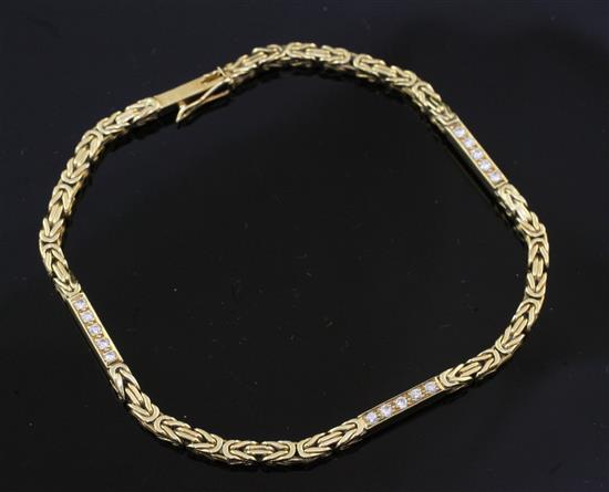 An 18ct gold and diamond fancy link bracelet, gross weight 9.7 grams.